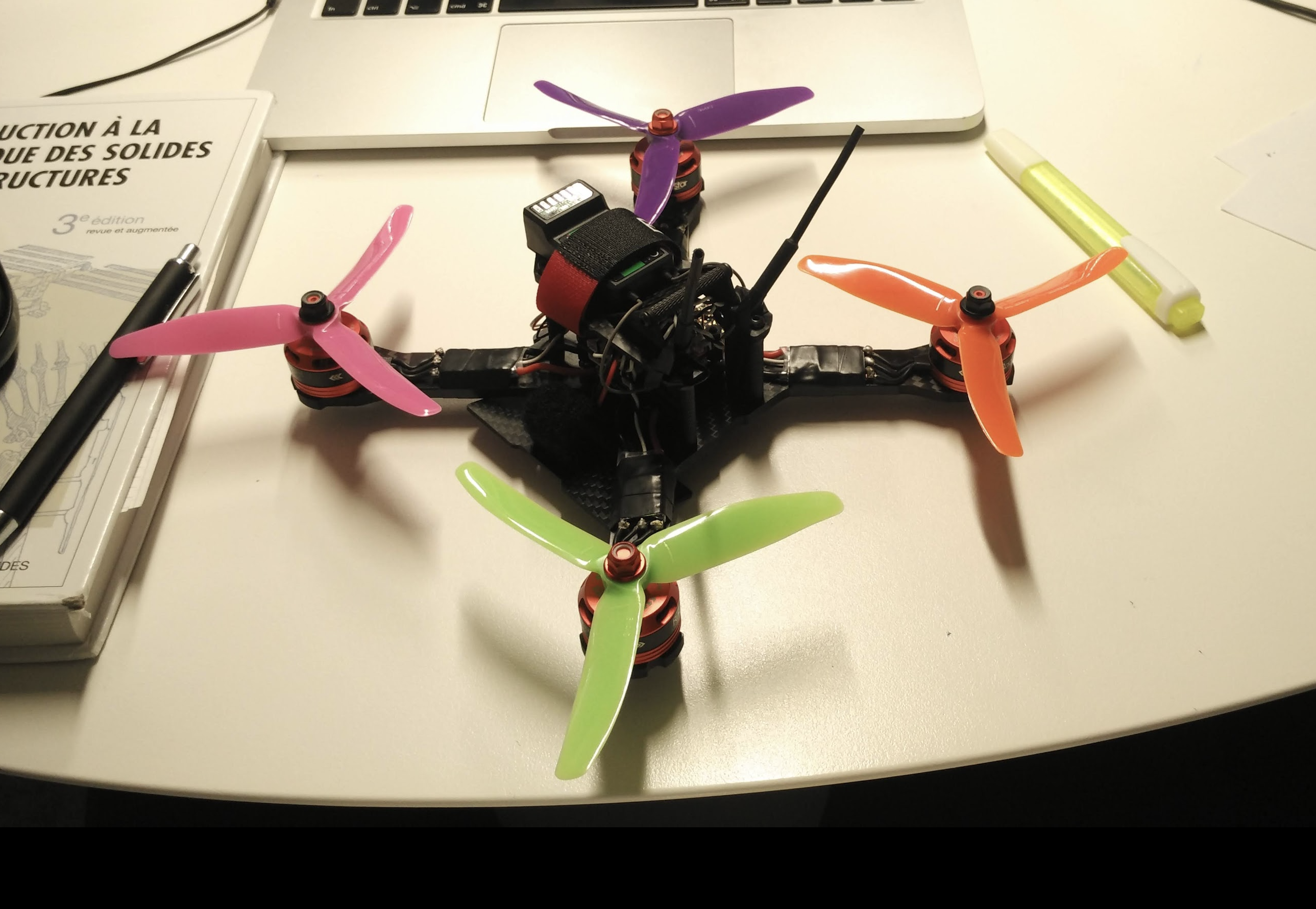 Finished racing quadcopter with props